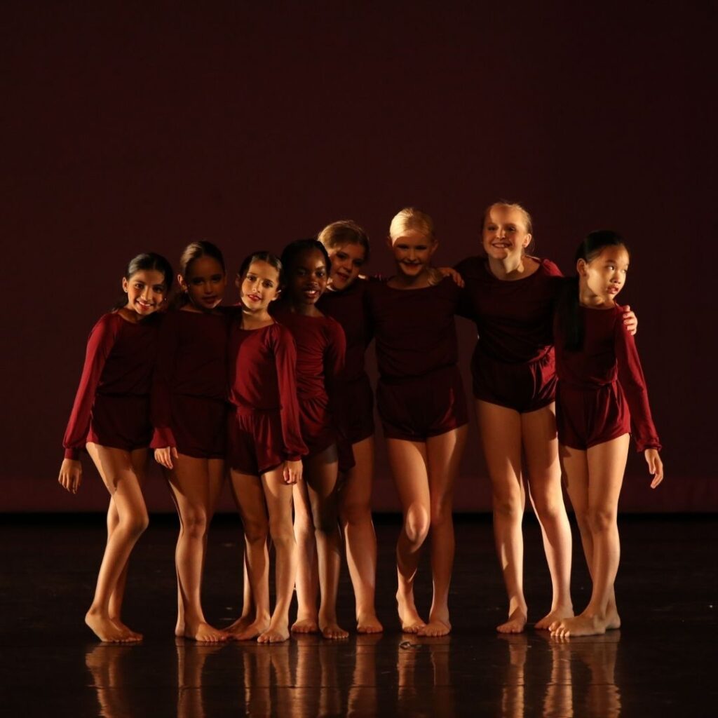 group of girls in dance costumes