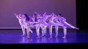 group of dancers on a stage at dance show