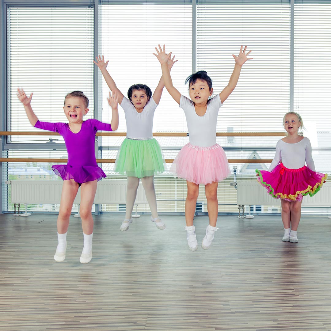 Group of young girls dancing in dance class